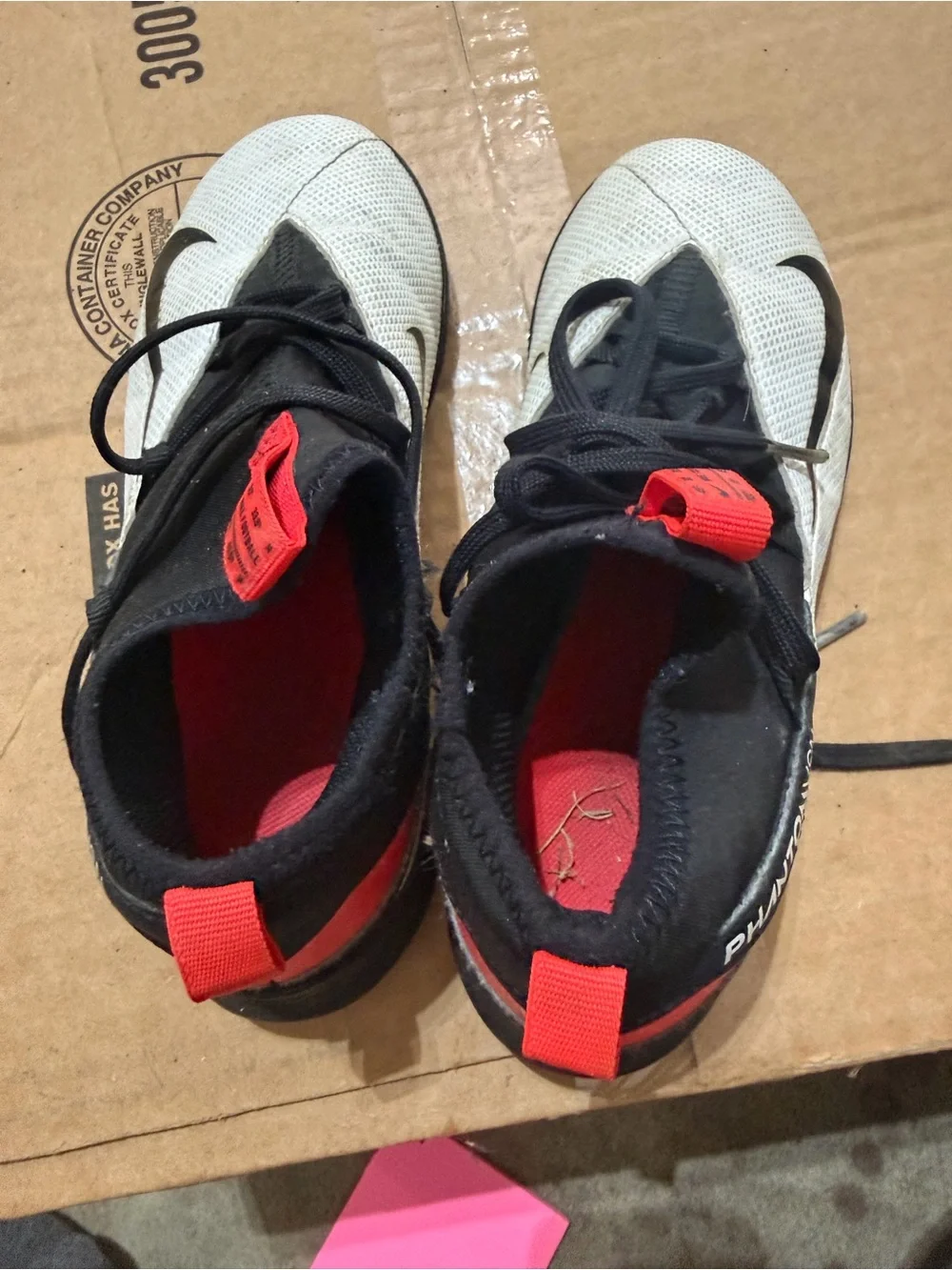 Nike Youth White and Black Athletic Trainers with Red Pull Tabs